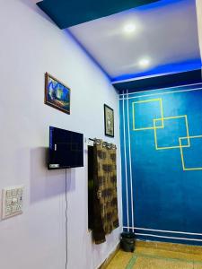 TV a/nebo společenská místnost v ubytování Hotel the saffron leaf inn + 6 fotografií