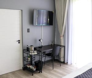 TV a/nebo společenská místnost v ubytování Bayley Boutique Guesthouse & Hydro Spa