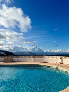 a swimming pool on top of a building at Mediterranean View Apartment in Denia