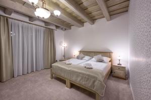 Postel nebo postele na pokoji v ubytování Hotel u dobrého pastiera