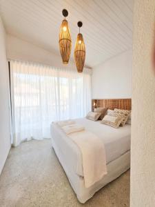 En eller flere senge i et værelse på Vila Anambé Serra Grande BA