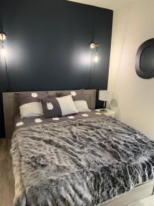 En eller flere senge i et værelse på Authentique &; Design