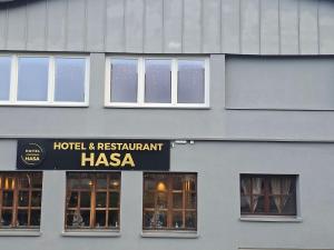 a building with a hotel and restauranthasa sign on it at Hotel & Restaurant Hasa in Gernrode - Harz