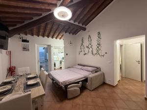 Ένα ή περισσότερα κρεβάτια σε δωμάτιο στο Il Poggiolino d'Oro