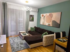 Posezení v ubytování Alex apartman + 2 fotografie