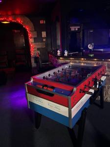 a large red and blue foosball table in a room at Forresters Bar & French Restaurant with Rooms in Middleton in Teesdale