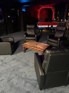 a room with couches and a table and a pool table at Forresters Bar & French Restaurant with Rooms in Middleton in Teesdale