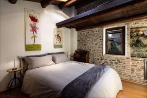 Postel nebo postele na pokoji v ubytování Al Paese Vecchio - Boutique house nel cuore del borgo