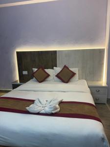 Postel nebo postele na pokoji v ubytování Hotel sunrise heaven