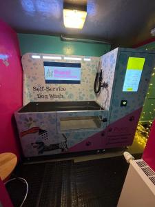 a dog washing machine with a sign that reads sent service dog wash at Forresters Bar & French Restaurant with Rooms in Middleton in Teesdale +57 photos