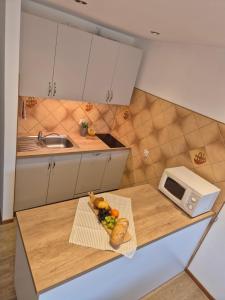 Kuchyň nebo kuchyňský kout v ubytování Apartamenty i Pokoje u Doroty