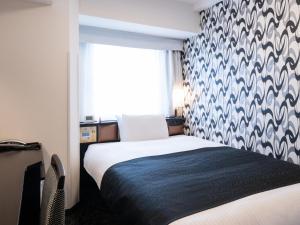 Postel nebo postele na pokoji v ubytování APA Hotel Ueno Ekimae + 108 fotografií