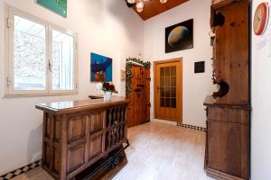 a room with a wooden cabinet and a window at Casa Puggimiano in Poggio Moiano