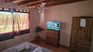 TV a/nebo společenská místnost v ubytování Nativo Malbec