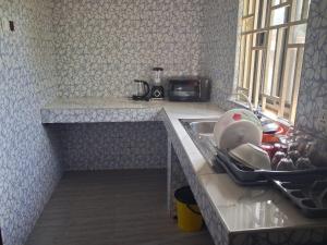 Kuchyň nebo kuchyňský kout v ubytování Acrra' Rent