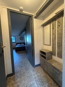 a room with a bathroom with a sink and a mirror at T1 a loué centre ville de Guéret in Guéret