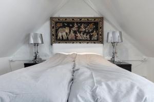 En eller flere senge i et værelse på Historical townhouse in the old town