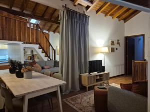 a living room with a couch and a table at A casa do cervo in Vila Nova de Cerveira