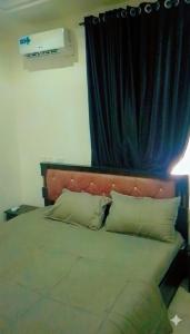 Ένα ή περισσότερα κρεβάτια σε δωμάτιο στο House 22 Apartment