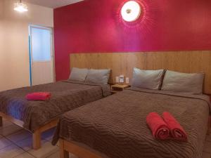 En eller flere senge i et værelse på Casa Porta Rosa