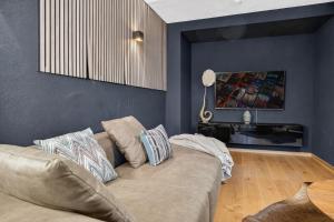 a living room with a couch and a table at 3 Queen Beds Waterfall Garage Terrace Center in Saarburg +30 photos