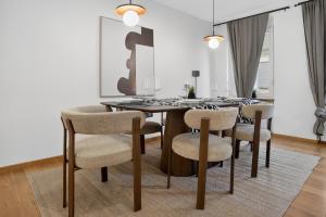 a dining room with a table and chairs at 3 Queen Beds Waterfall Garage Terrace Center in Saarburg