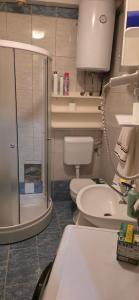 a bathroom with two toilets and a sink at Apartman Savic Jahorina in Jahorina