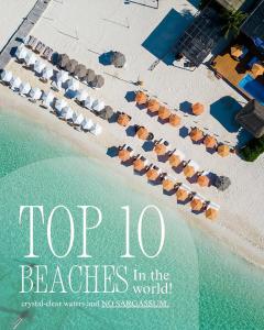 capa de livro com as melhores praias do mundo em Casa Rocka Boutique Breakfast & Beach Club included em Ilha das Mulheres