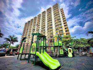 a playground in front of a large building at Meraki Space Mactan Cebu in Lo-oc
