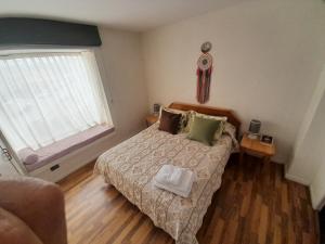 Ένα ή περισσότερα κρεβάτια σε δωμάτιο στο Bella vista al mar y cerca!!