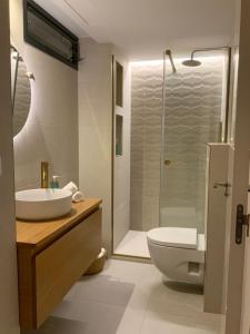 a bathroom with a sink and a toilet and a shower at Luxury Beachfront "Felicità" Sea View 6 Guests in Arenales del Sol +26 photos