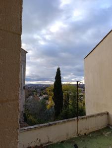 a view from the window of an old building at Glauque Room Horror and cinema themed studio in Béziers