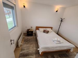 Postel nebo postele na pokoji v ubytování Vinogradi Zmajevački + 41 fotografií