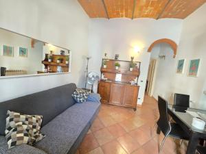 a living room with a couch and a table at Luisina 78 ONLY ADULTS in Viareggio
