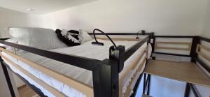 a couple of bunk beds in a room at Joli T2 cozy, proche plages, Terra Doru B02 in Propriano