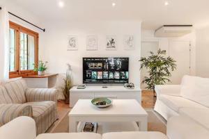 a living room with a couch and a table at Villa Tesoro, El Toro, South West Mallorca in El Toro
