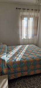 Кровать или кровати в номере Mugello, vicino lago, Outlet