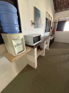 Μια τηλεόραση ή/και κέντρο ψυχαγωγίας στο Casa Beira-Mar no Centro de Pipa - 8 Quartos