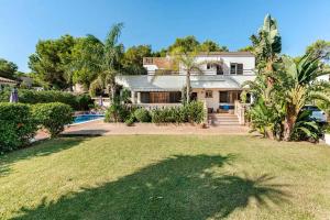 a house with a large yard with a pool at Villa Tesoro, El Toro, South West Mallorca in El Toro