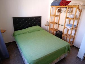 Ένα ή περισσότερα κρεβάτια σε δωμάτιο στο Departamentos Talamuchita