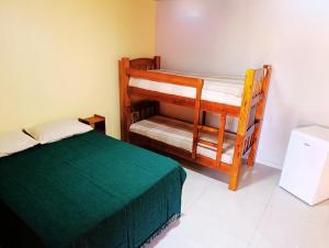 Postel nebo postele na pokoji v ubytování SUÍTES PRIVATIVA em Brotas -