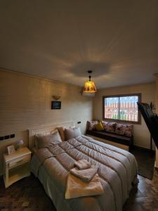 Giường trong phòng chung tại Residence Imlil Ouarzazate