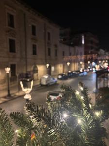 a christmas tree on a city street at night at Panta Rei 97 in Barletta