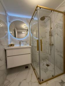 a bathroom with a shower and a sink at City Center Lux Studio in Athens