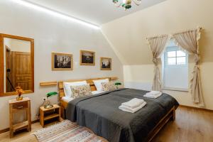 En eller flere senge i et værelse på Apartmány FRANZ