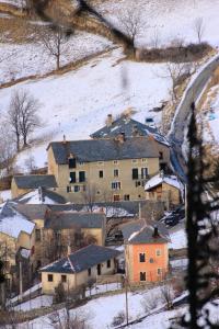 a group of houses on a hill in the snow at Gîtes de la Ferme Basso in Planès