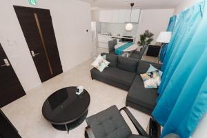 Et opholdsområde på Sunstone Residence 2F - Free Rental Car included!