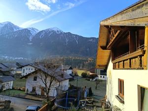 a view of a village with mountains in the background at Krumm und Schief Appartments in Brunau