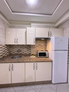 Kuchyň nebo kuchyňský kout v ubytování River Place Appartement