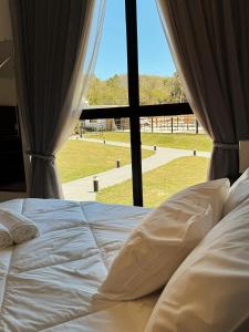 Giường trong phòng chung tại Mandacaru Encantado